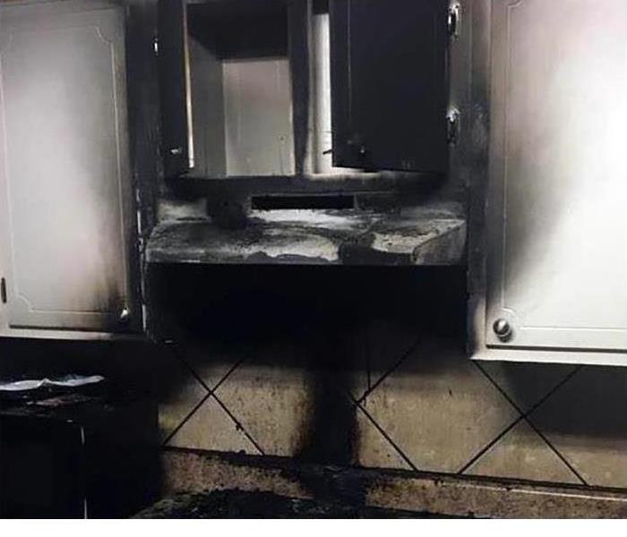 A kitchen that has been burnt after a fire 